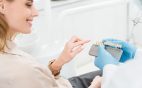 Dental implants look like natural teeth and restore full functionality.