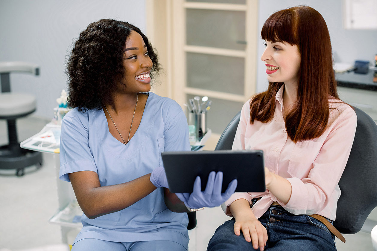A patient having an oral surgery consultation near me with their dentist