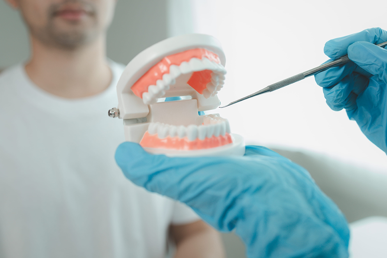 A patient having an oral surgery consultation near me with their dentist